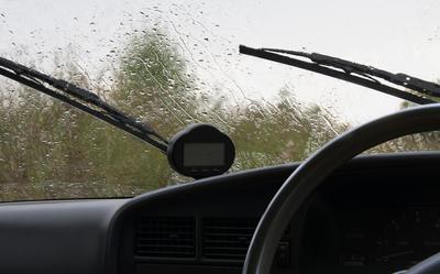 Rain falling on a brand new windshield install. 